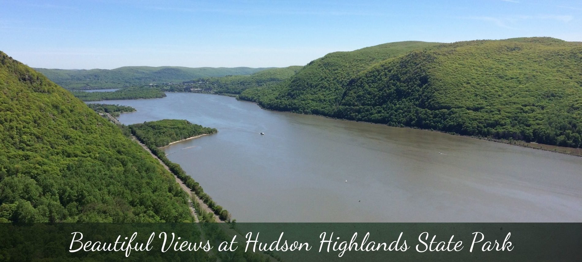 Expansive forested area with large river running between tree covered mountains