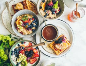 Elegant tables cape full of a variety of breakfast food on white plates